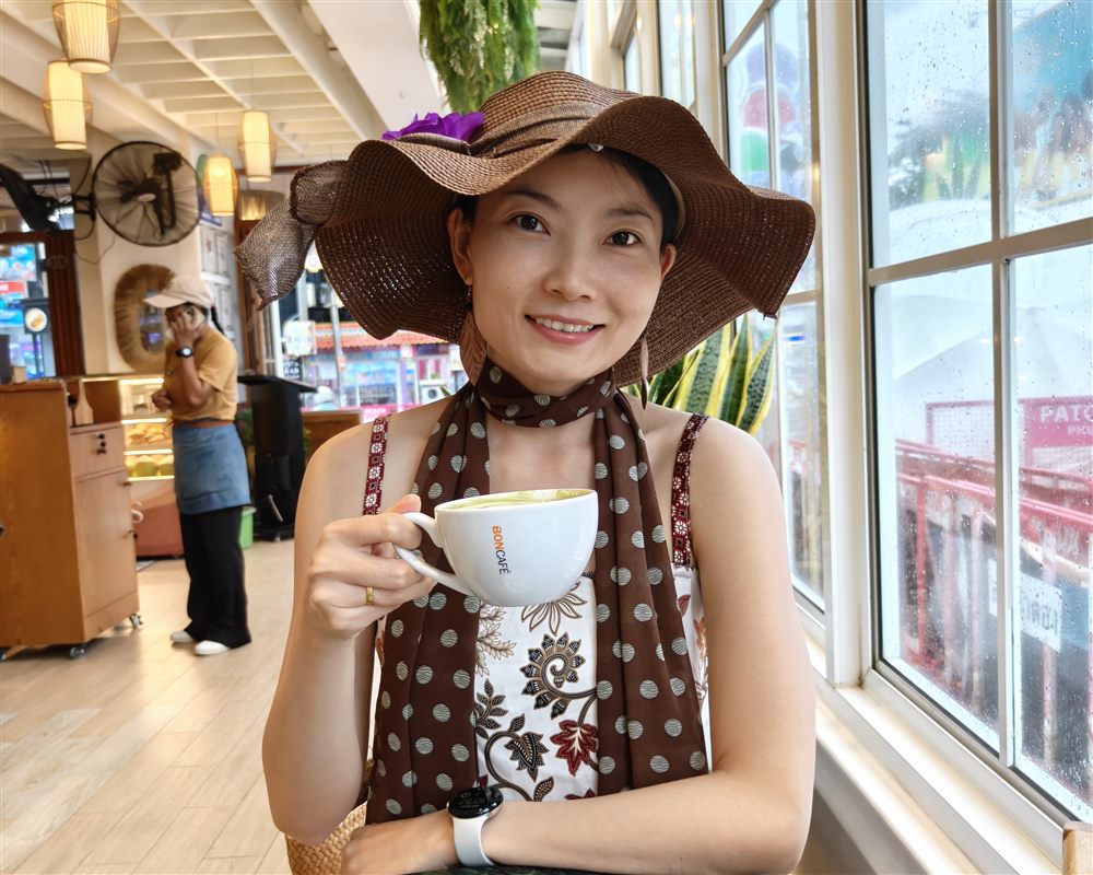 Teacher Lucky in a warm cafe portrait