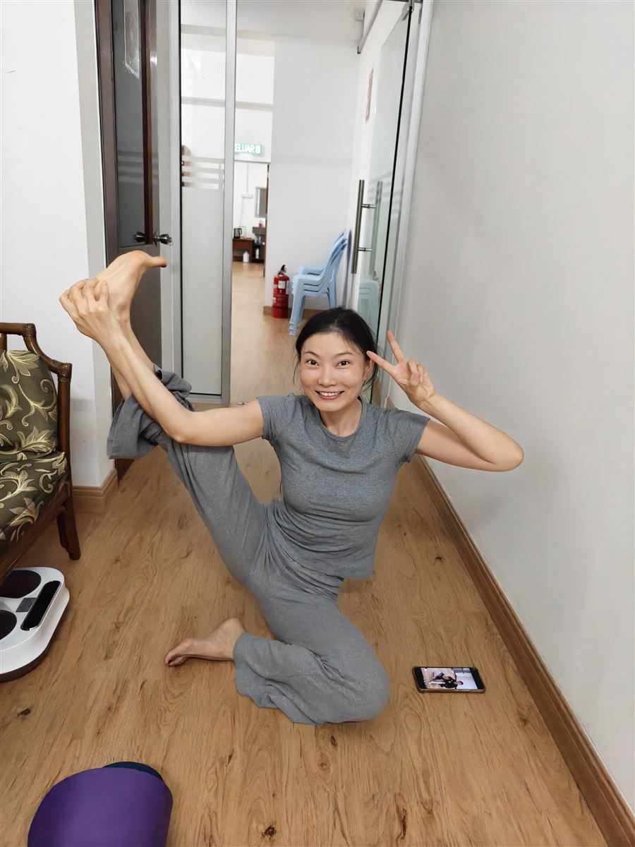 Teacher Lucky in a playful yoga pose